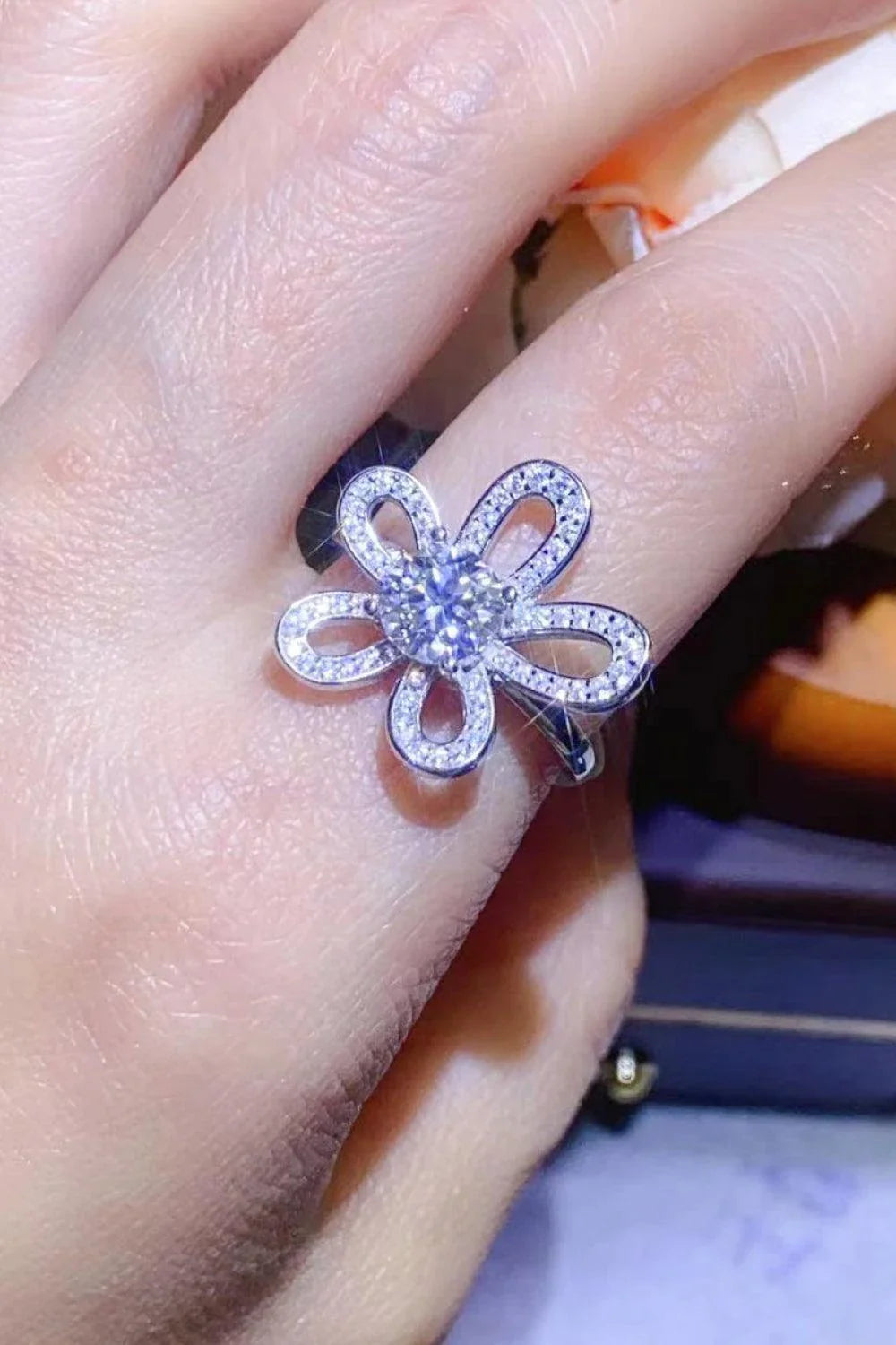 Moissanite flower-shaped open ring with 1 carat center stone and platinum plating