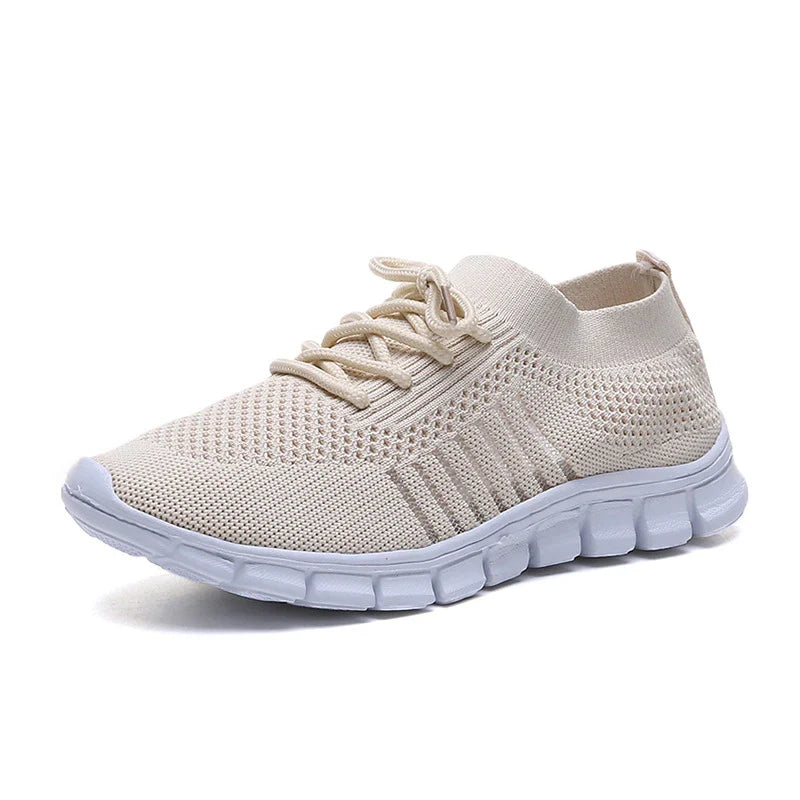 Breathable woven mesh shoes in various colours with a stylish cross-strap design and a durable rubber sole for all-day comfort.