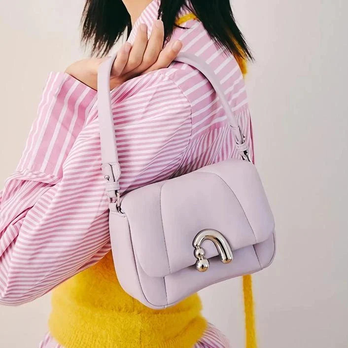 Premium sheep leather crossbody bag in beige color with hobo shape and secure lock closure for Kiwi women