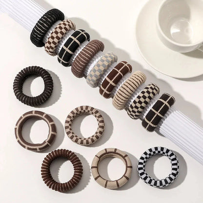 Stylish knitted lattice hair scrunchies in a black and white striped pattern, perfect for Kiwi women's hair accessories