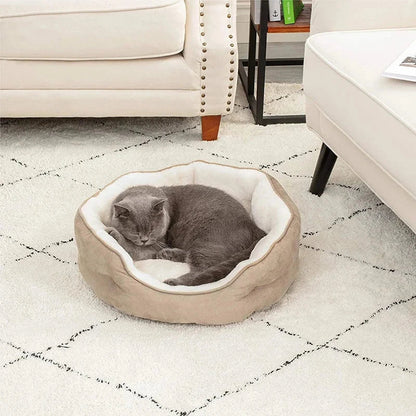 Cozy round small pet bed in beige color with soft microfiber fleece material and non-slip bottom