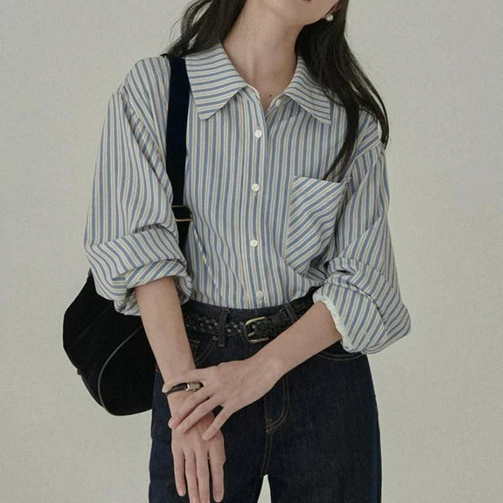 Elegant striped long sleeve blouse for women, featuring a turn-down collar and button details for a refined look.