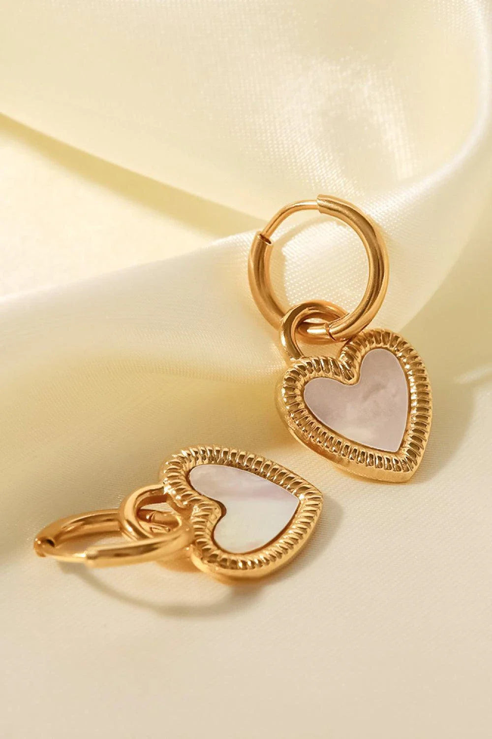 Stunning shell heart drop earrings with a premium stainless steel and shell design, perfect for the modern Kiwi style