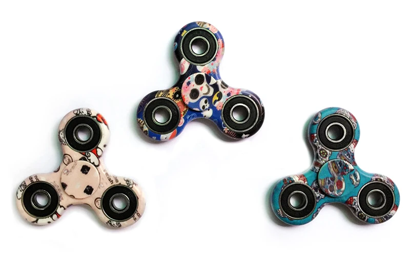 A premium designer spinner in various colors, designed to provide stress relief and improve focus for Kiwis