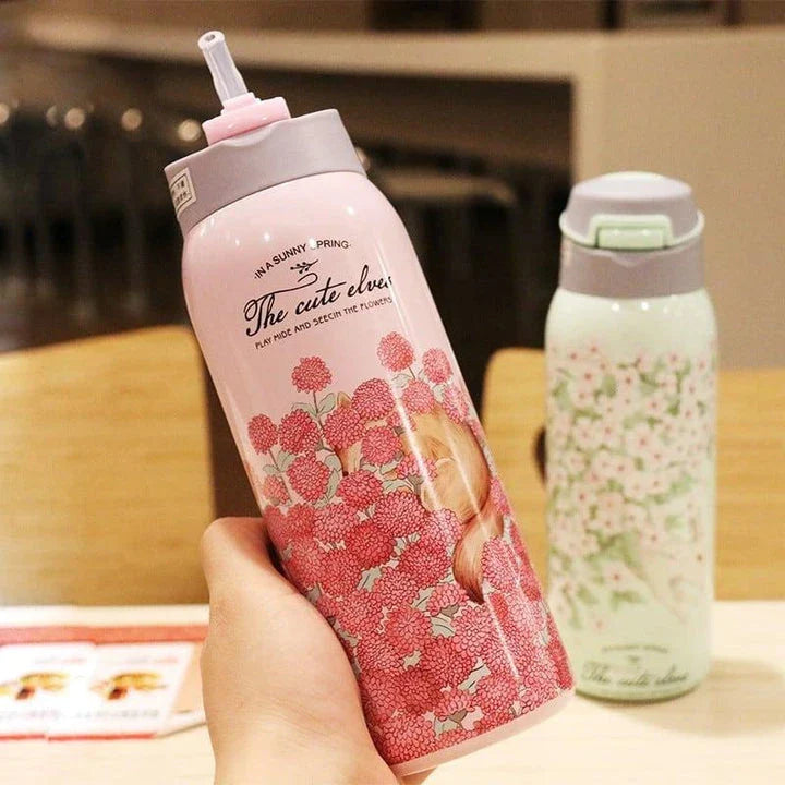 Stylish floral-patterned double-walled water bottle with straw, designed to keep drinks ice-cold for up to 12 hours in the warm New Zealand summer