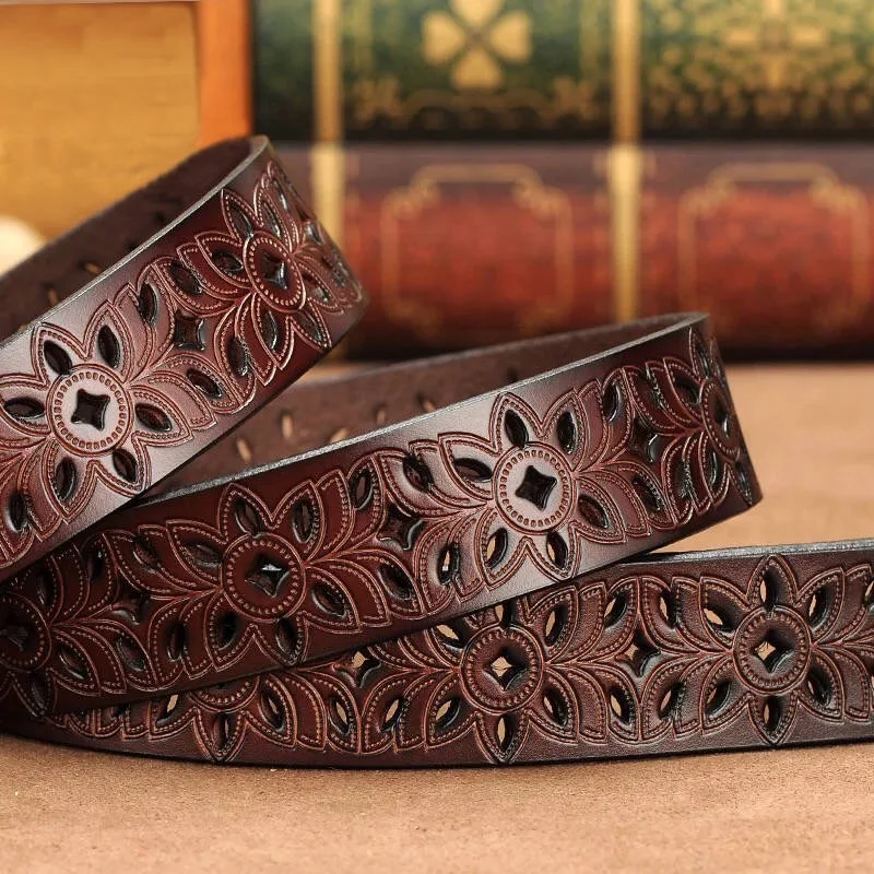 Stylish carved genuine leather belt in brown, black, red, and white colors with adjustable lengths