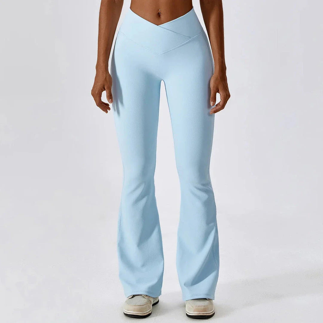 A pair of high-waisted, cross-waist yoga flare leggings in sky blue colour, perfect for yoga, fitness, and active adventures.