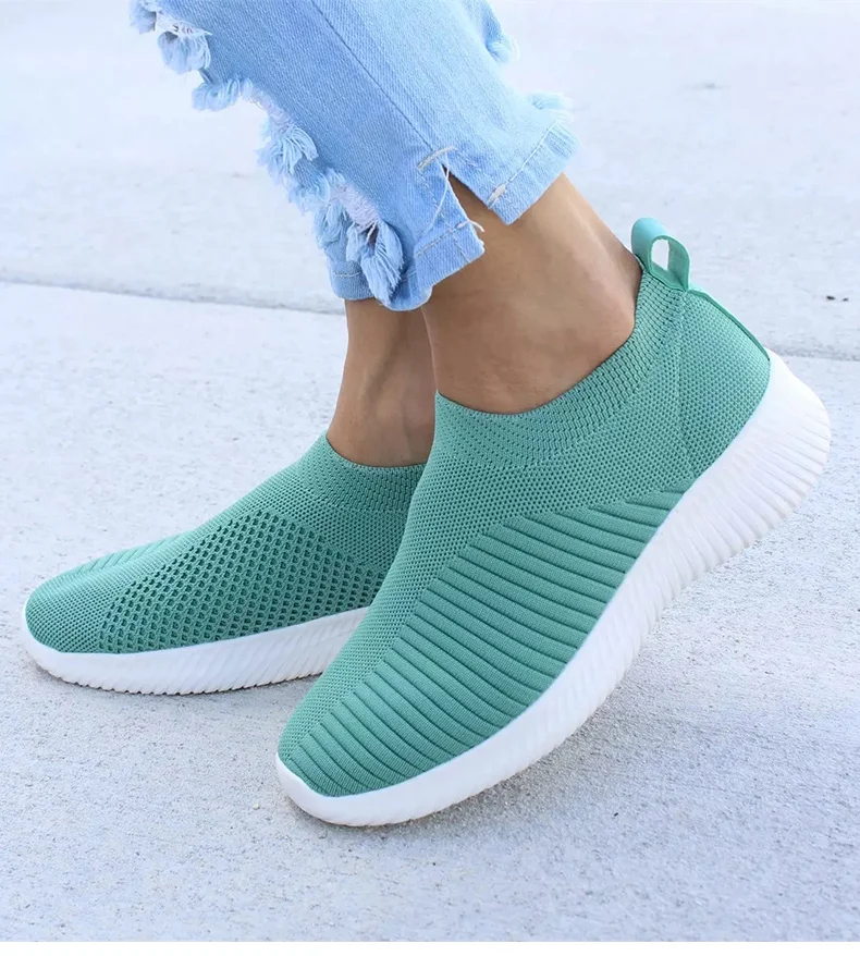 Ultra-comfortable casual slip-on summer sneakers in various colours, featuring a stretch fabric upper, rubber outsole, and cotton lining for a relaxed, breathable fit.