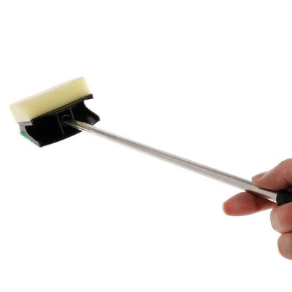 A stainless steel cleaning brush with a double-sided sponge, designed for efficient cleaning on various surfaces in the home.