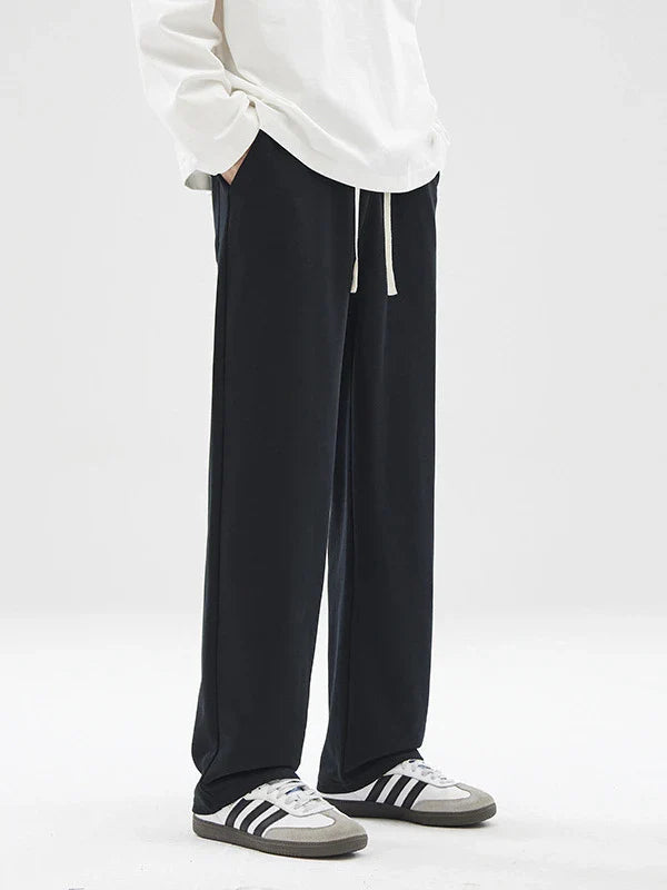 Straight gray sweatpants with a chic draping effect, perfect for Kiwi casual fashion