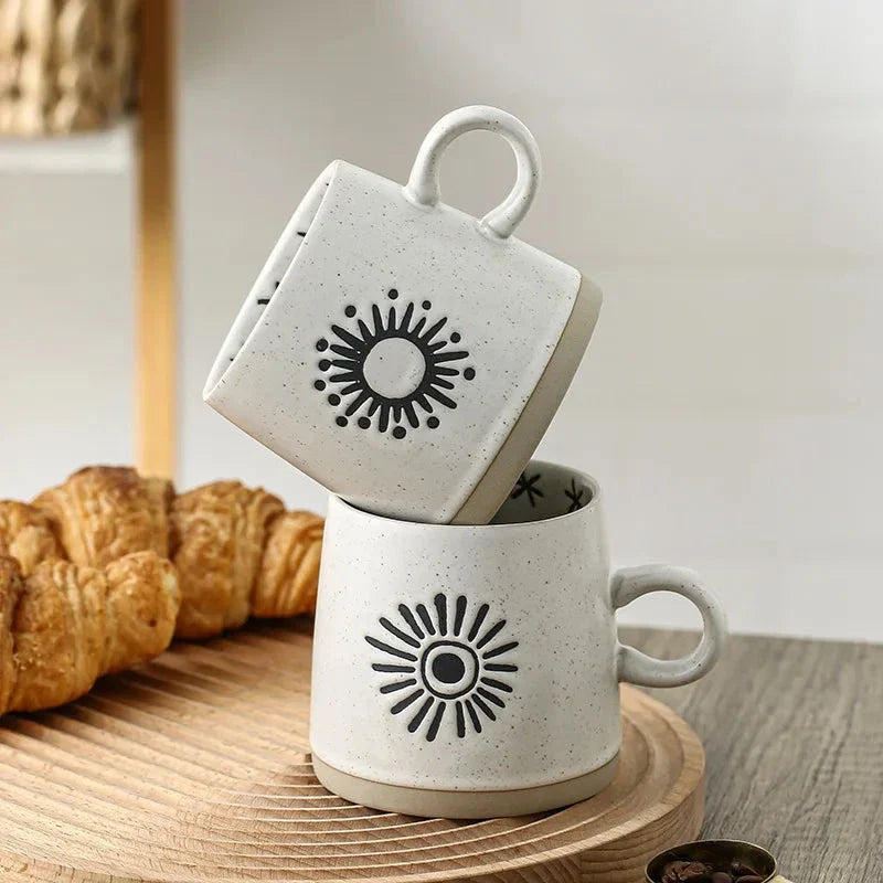 Handcrafted Japanese-inspired ceramic coffee mug with unique floral or sun design