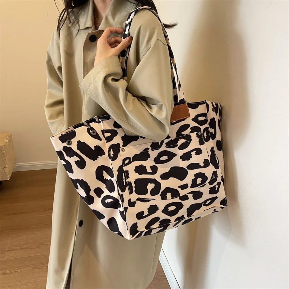 Oversized leopard print canvas shoulder bag with ample storage and stylish design, perfect for Kiwi women