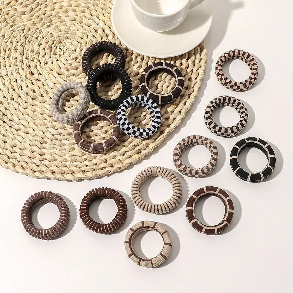 Stylish knitted lattice hair scrunchies in a black and white striped pattern, perfect for Kiwi women's hair accessories