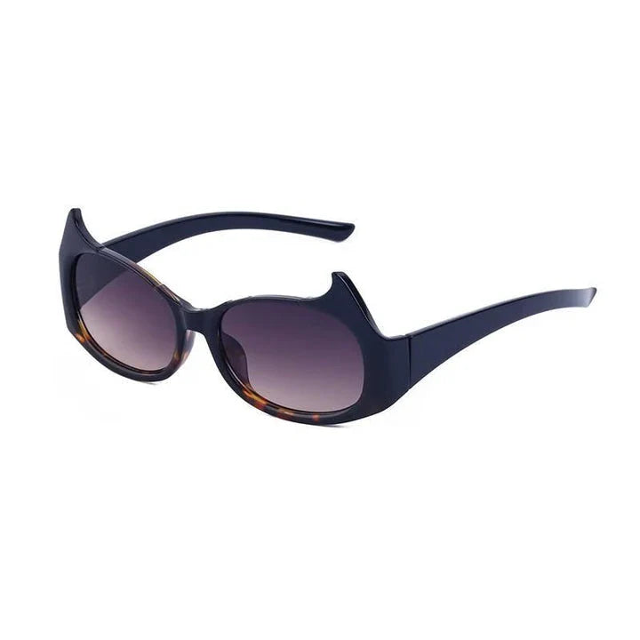 Stylish cat-eye luxury sunglasses with oversized frames and semi-rimless design in a leopard gray color