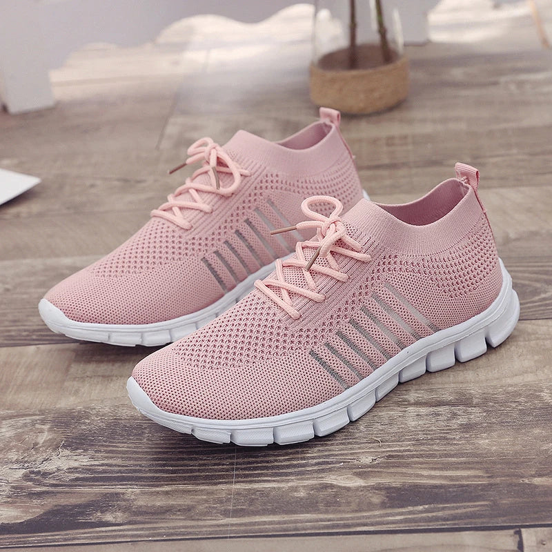 Breathable woven mesh shoes in various colours with a stylish cross-strap design and a durable rubber sole for all-day comfort.