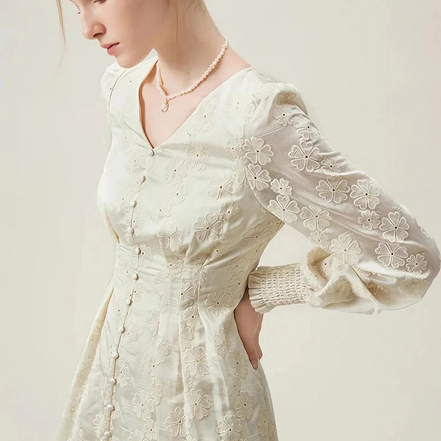 A long-sleeved jacquard dress in beige with a vintage-inspired, romantic design and a comfortable, flattering fit.