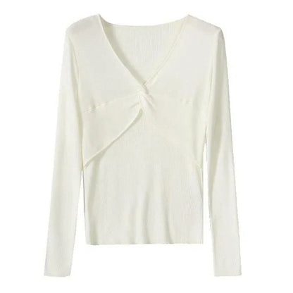 A stylish V-Neck jumper in dark grey, featuring a unique criss-cross design and a flattering slim fit for the modern Kiwi woman.