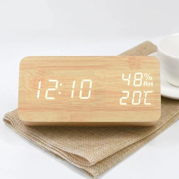 Wooden, luminous, and silent alarm clock with humidity monitoring and temperature display for baby's room