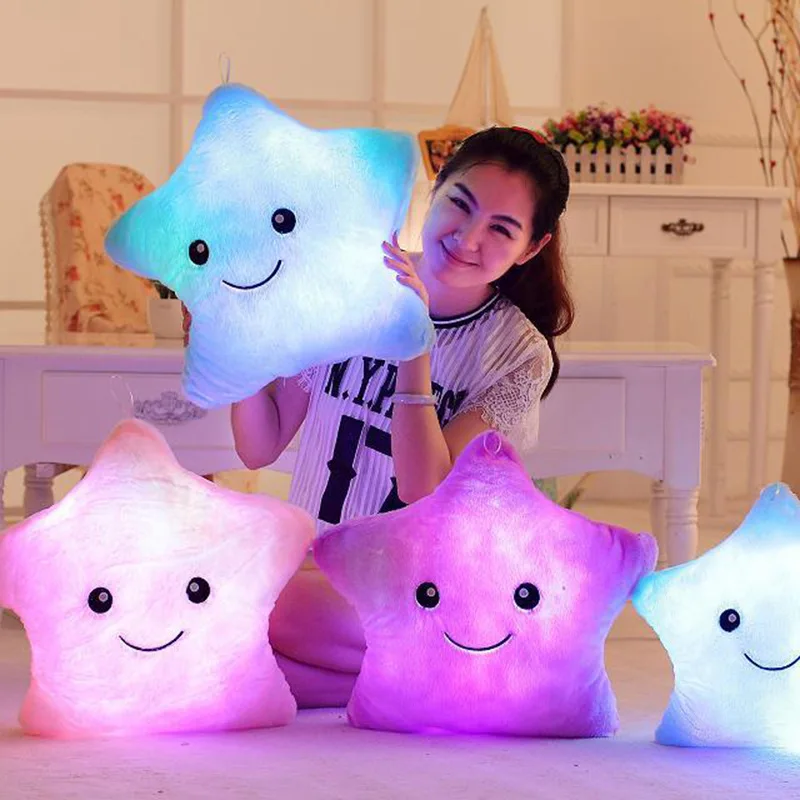 Soft, glowing plush pillow in the shape of a star, perfect for cuddling and providing a soothing nightlight for Kiwi kids