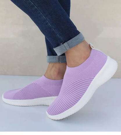 Ultra-comfortable casual slip-on summer sneakers in various colours, featuring a stretch fabric upper, rubber outsole, and cotton lining for a relaxed, breathable fit.