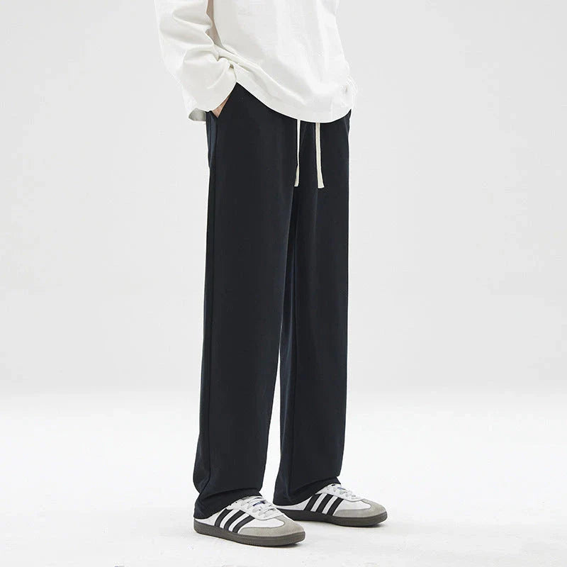 Straight gray sweatpants with a chic draping effect, perfect for Kiwi casual fashion