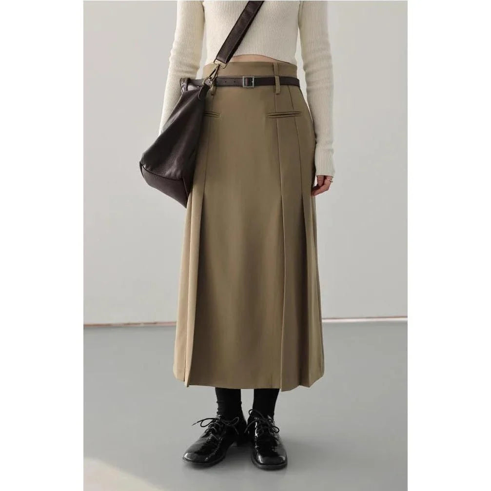 Elegant high-waisted pleated a-line skirt in a classic solid color for versatile wear throughout the autumn and winter seasons.