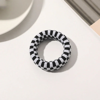 Stylish knitted lattice hair scrunchies in a black and white striped pattern, perfect for Kiwi women's hair accessories