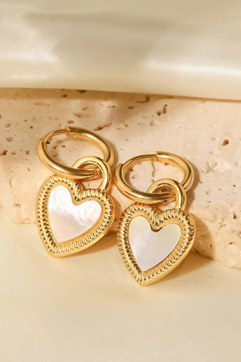 Stunning shell heart drop earrings with a premium stainless steel and shell design, perfect for the modern Kiwi style