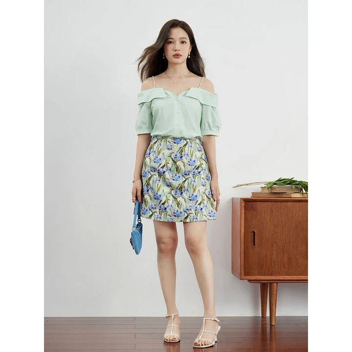 Elegant floral a-line mini skirt for Kiwi women, featuring a high waistline, flowing silhouette, and vibrant floral print