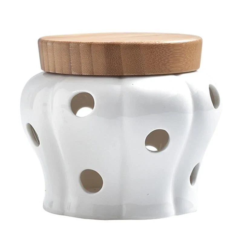 A stylish ceramic and wood garlic storage jar with a sleek, minimalist design, perfect for Kiwi kitchens.