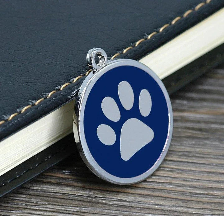 Premium stainless steel dog ID tag with a unique paw print pattern, designed for the active Kiwi lifestyle