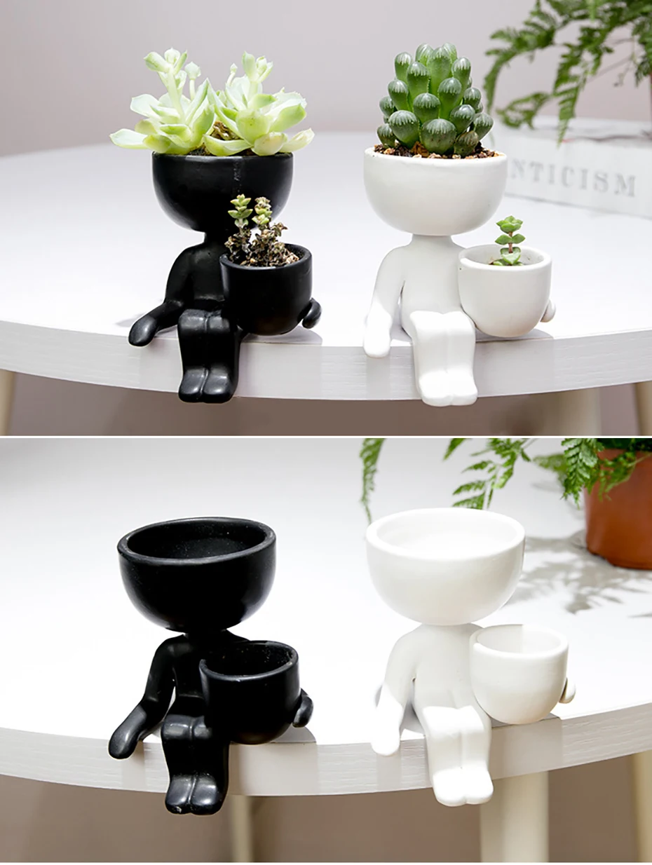 Stylish ceramic planter in black or white, featuring a unique humanoid design perfect for growing indoor plants