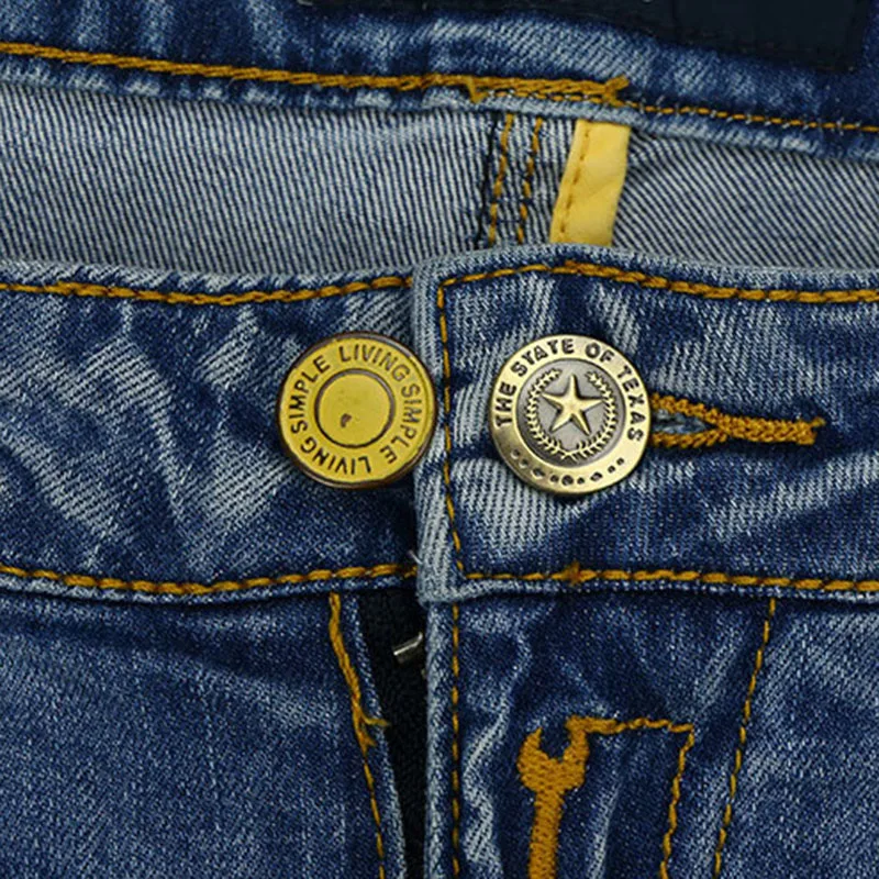 Adjustable metal buttons in various colors for customizing the fit of jeans and pants