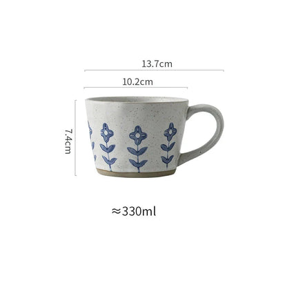 Handcrafted Japanese-inspired ceramic coffee mug with unique floral or sun design