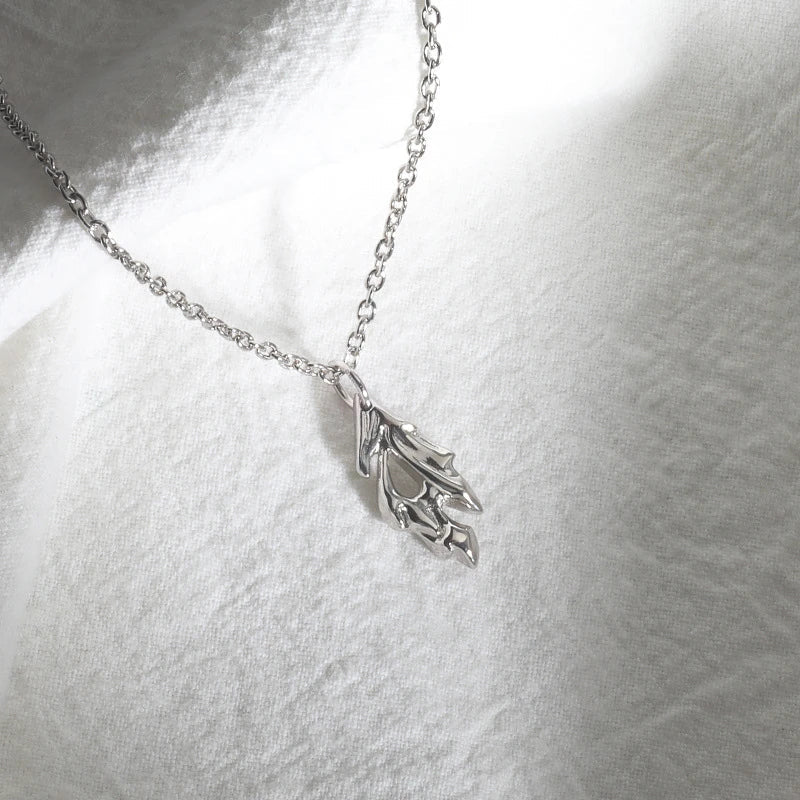 A silver charm pendant with an intricate design, perfect for the modern Kiwi bloke's fashion needs