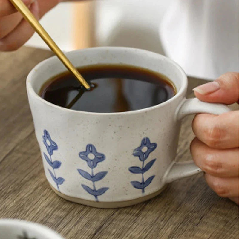 Handcrafted Japanese-inspired ceramic coffee mug with unique floral or sun design