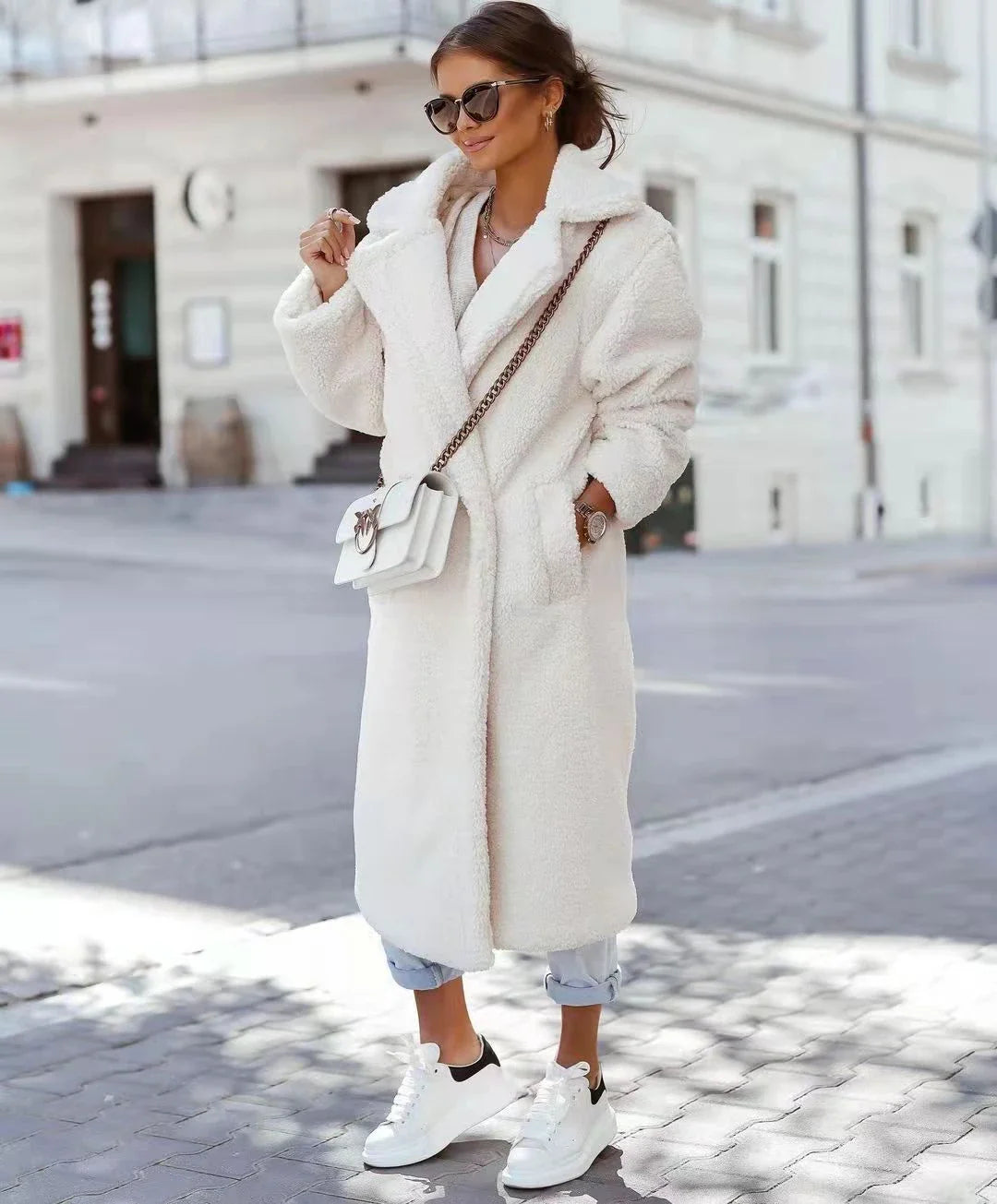 Stylish women's long fur coat with an irregular single-breasted design, available in a range of classic Kiwi-inspired colours