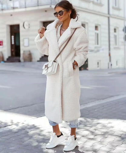 Stylish women's long fur coat with an irregular single-breasted design, available in a range of classic Kiwi-inspired colours