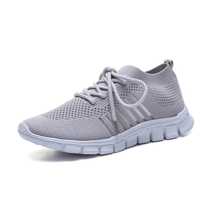 Breathable woven mesh shoes in various colours with a stylish cross-strap design and a durable rubber sole for all-day comfort.