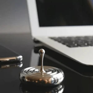 Elegant rotating gyroscope desk accessory with a mesmerizing, long-lasting spin