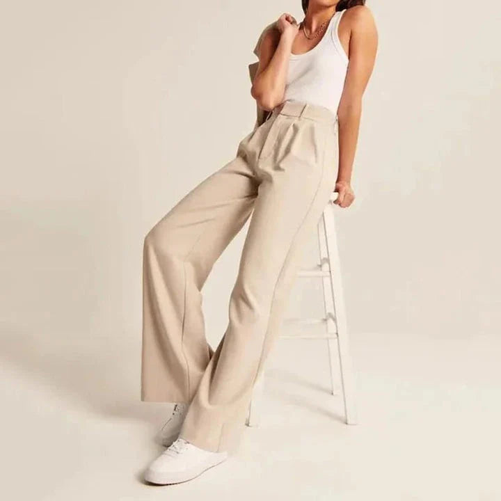 Elegant high-waisted wide-leg trousers in a gray-blue color, perfect for the modern woman's wardrobe.