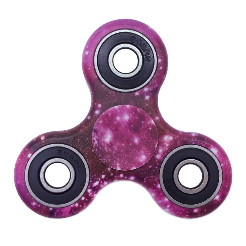 A premium designer spinner in various colors, designed to provide stress relief and improve focus for Kiwis