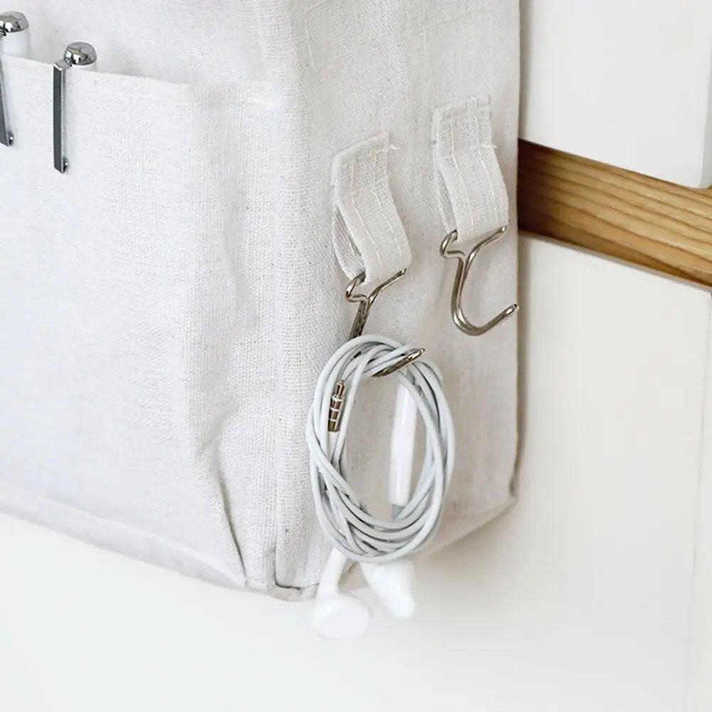 Versatile hanging storage organiser in white and light grey, featuring multiple compartments and hooks for customisable storage in a Kiwi home