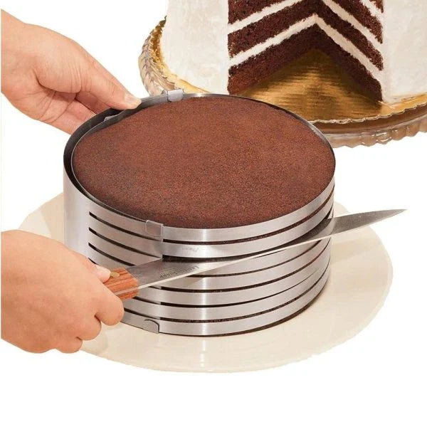 An adjustable stainless steel cake slicer with a ring that can be expanded or shrunk to fit cakes of different sizes, up to 12 inches in diameter.