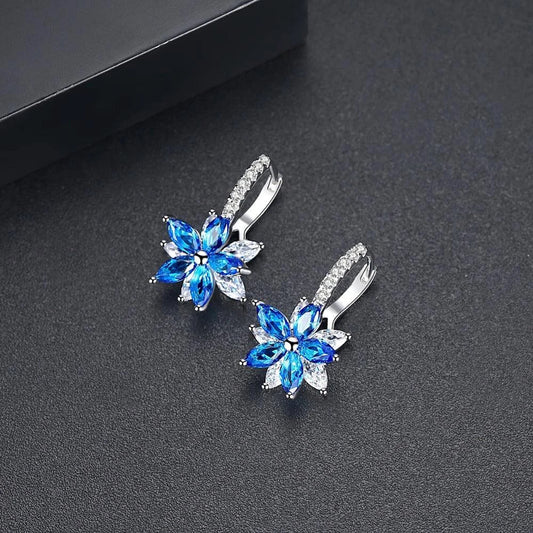 Stunning copper earrings with snowflake zircon design and vibrant multicolor accents, perfect for adding Kiwi flair to your look.