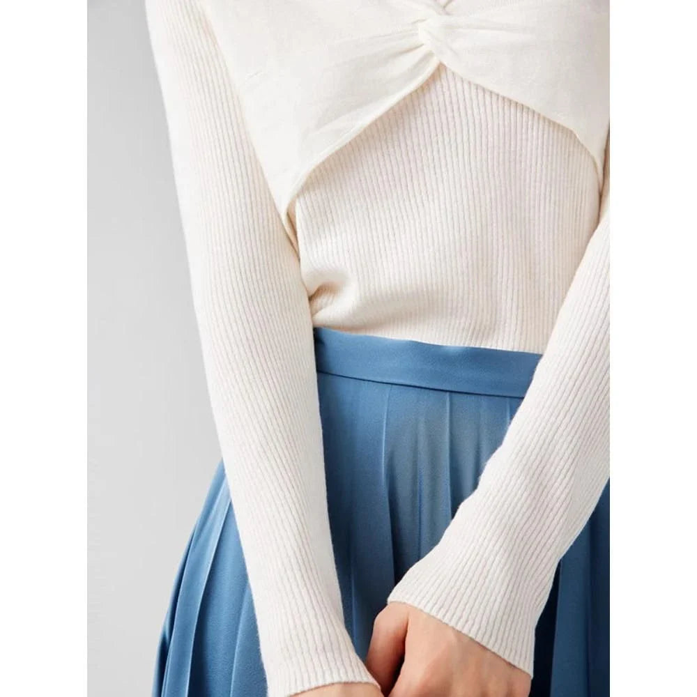 A stylish V-Neck jumper in dark grey, featuring a unique criss-cross design and a flattering slim fit for the modern Kiwi woman.