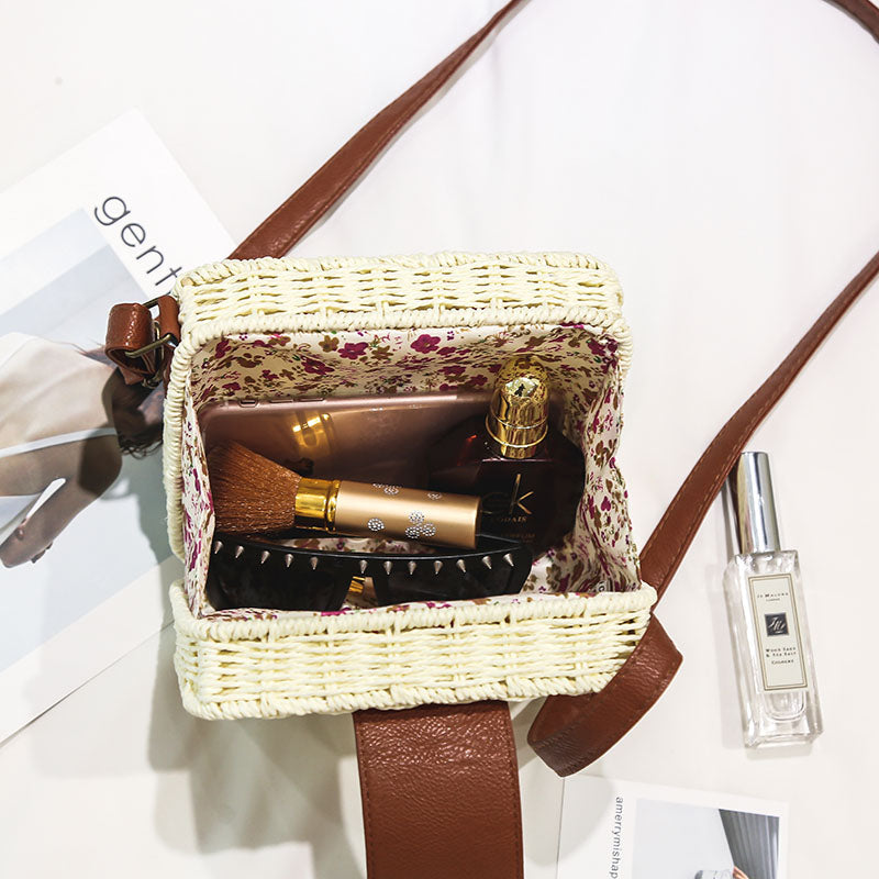 A collection of hand-woven tropical straw purses in various shapes, sizes, and designs, perfect for Kiwi summer style.