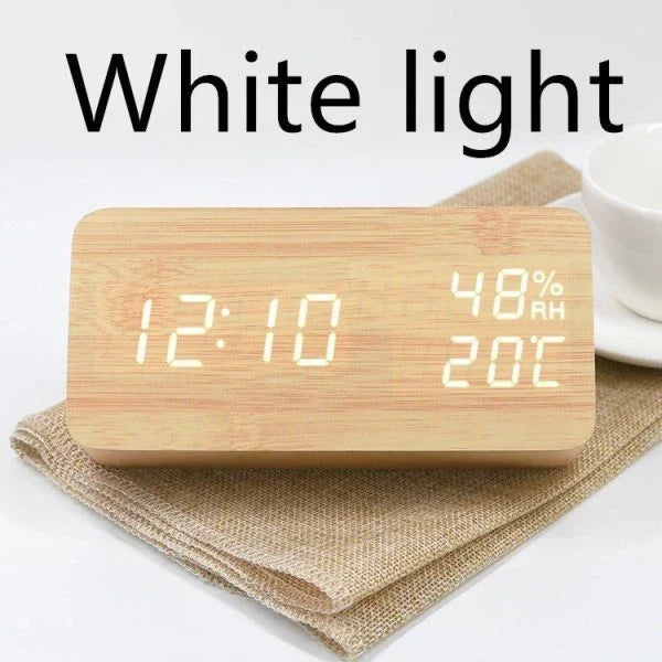 Wooden, luminous, and silent alarm clock with humidity monitoring and temperature display for baby's room