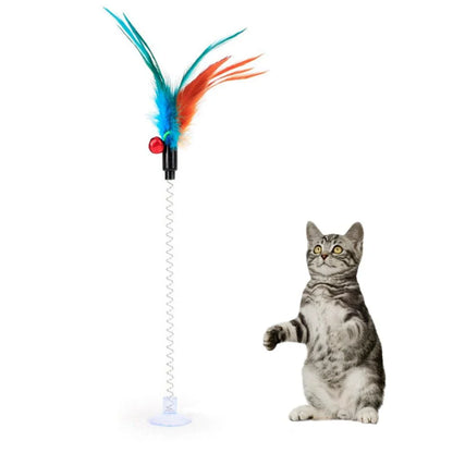 The Interactive Cat Toy Feather with a green feather and sturdy plastic ball, designed to engage cats in energetic play and satisfy their natural hunting behaviours.