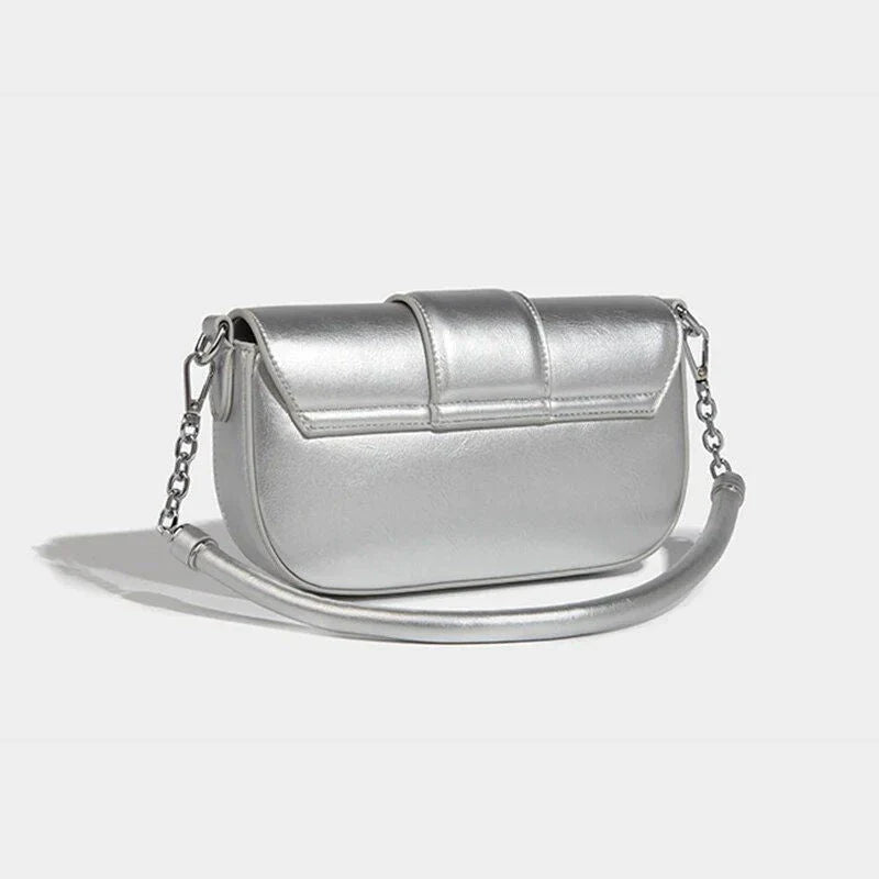 Elegant silver shoulder and crossbody bag for women, featuring a flap design and adjustable straps for versatile use